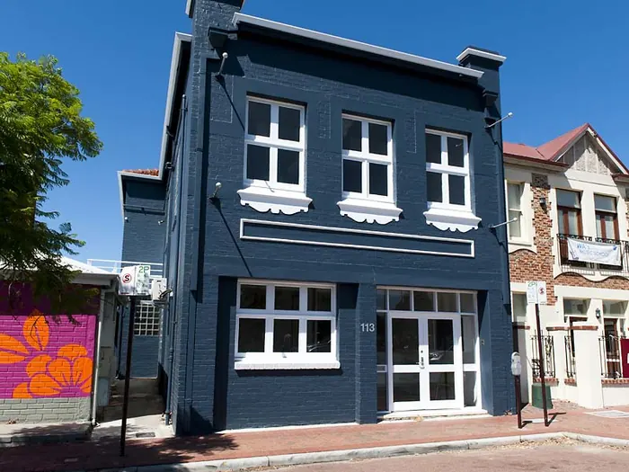 JDL Strategies, Newcastle Street Northbridge — restored two-storey heritage facade in dark blue.